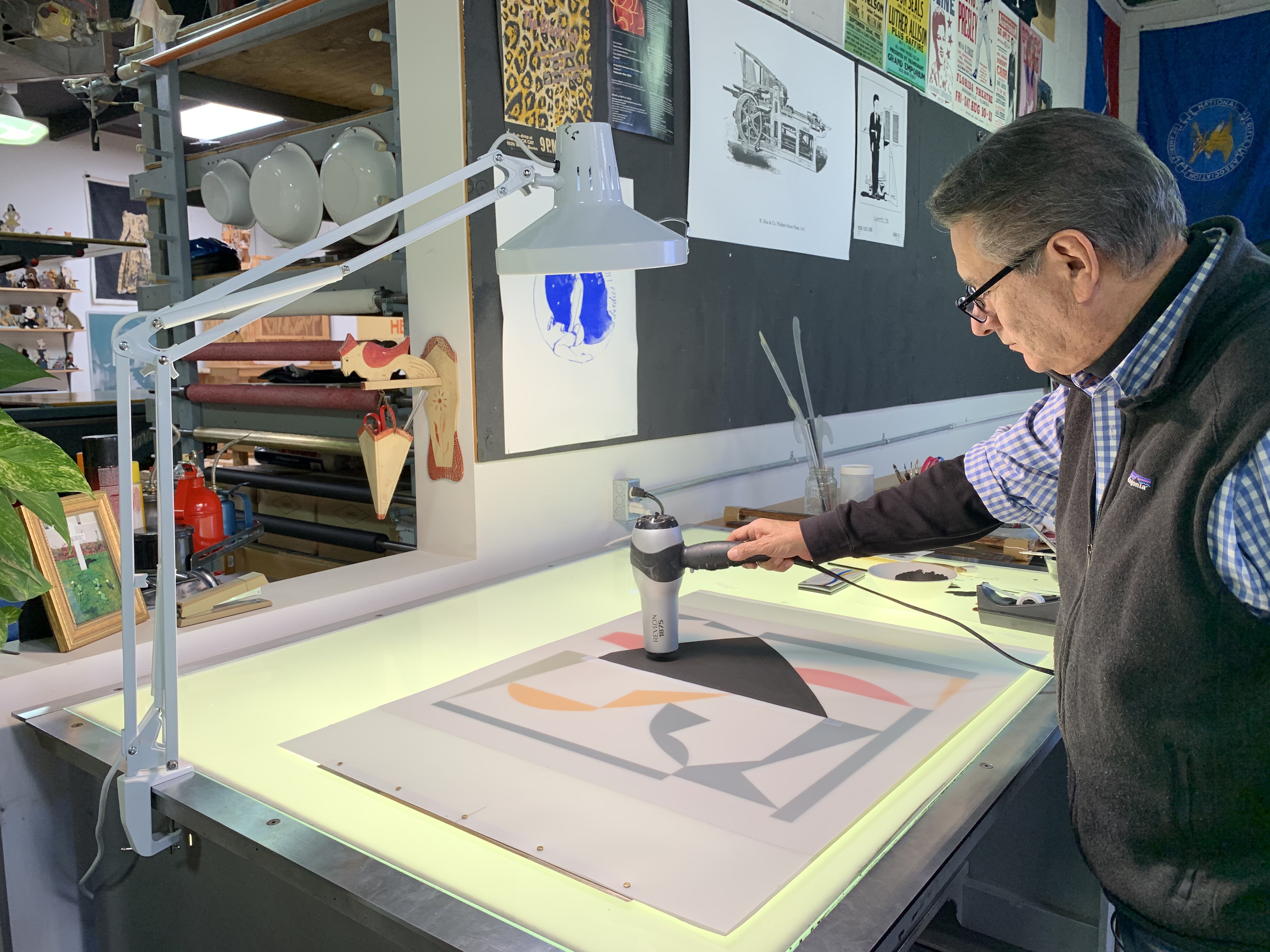 Artist Dan Namingha printmaking at Black Rock Editions print shop