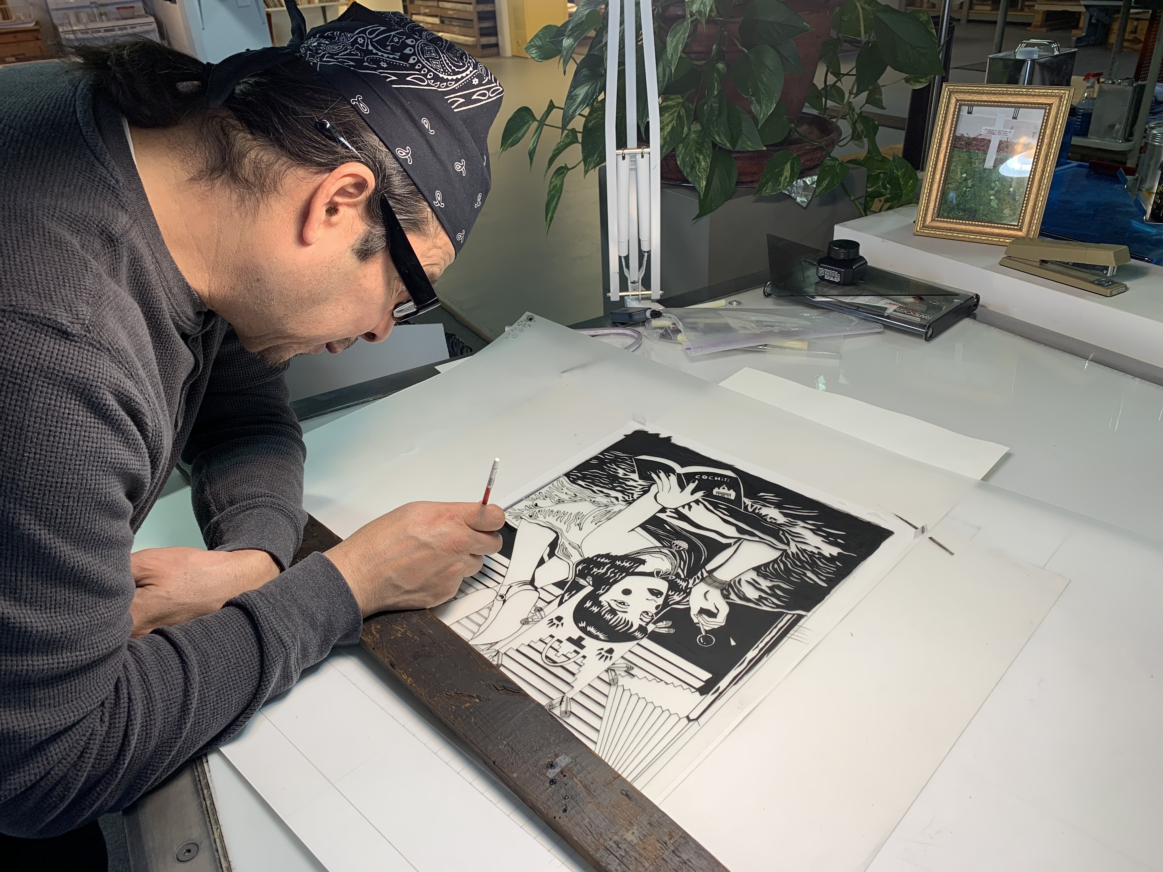 Artist Diego Romero printmaking at Black Rock Editions print shop