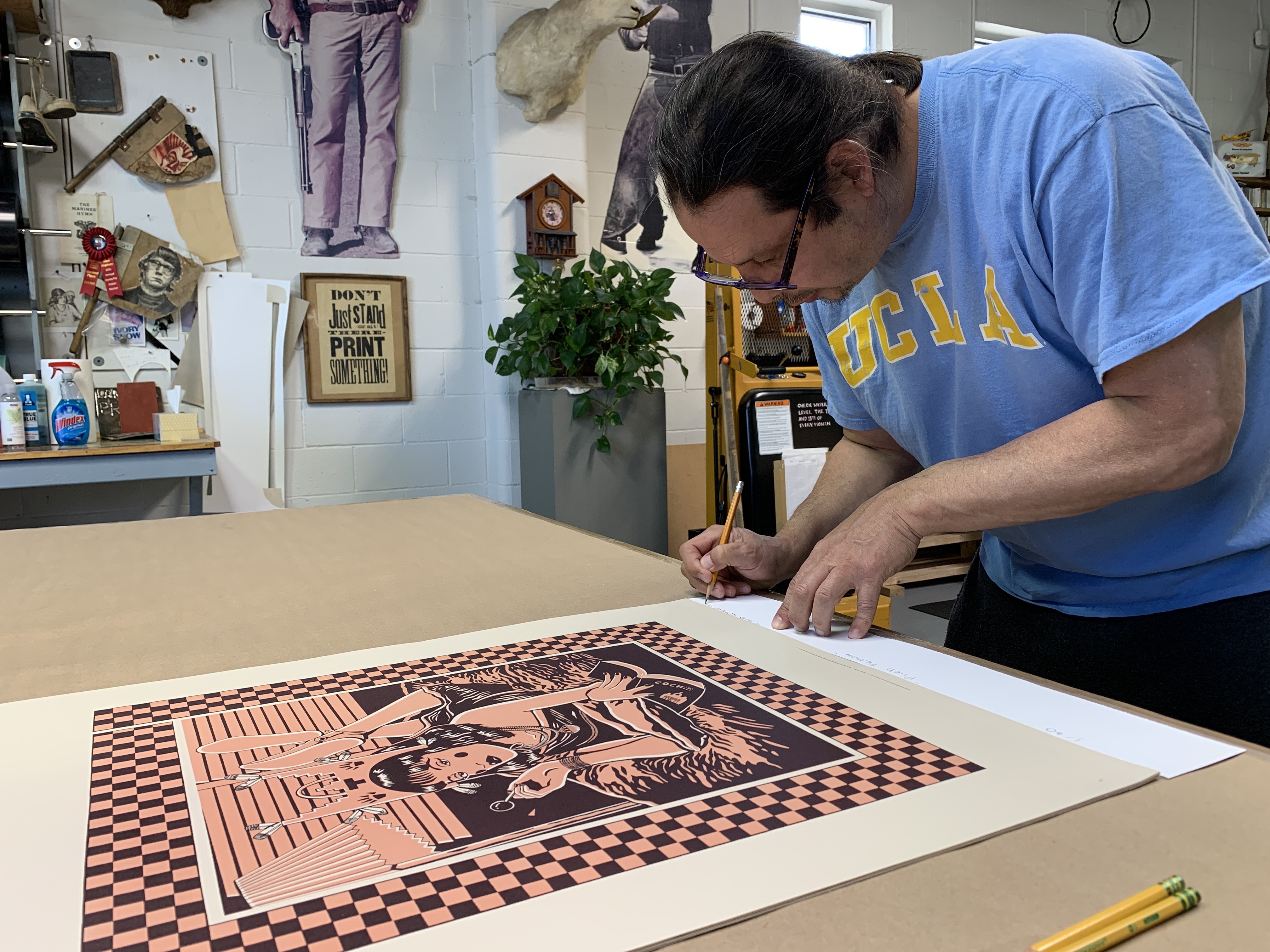 Artist Diego Romero printmaking at Black Rock Editions print shop